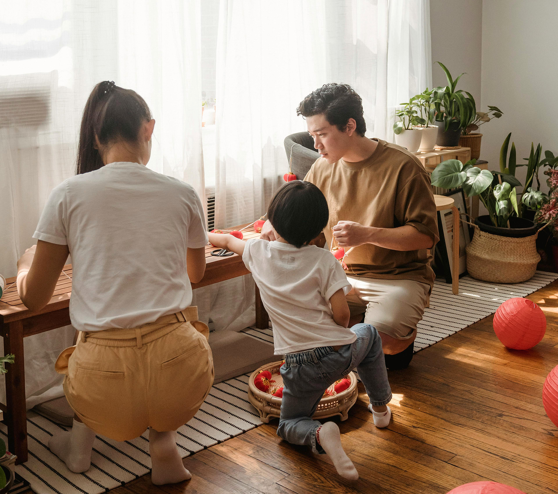 Family of 3 with son being together - Banner