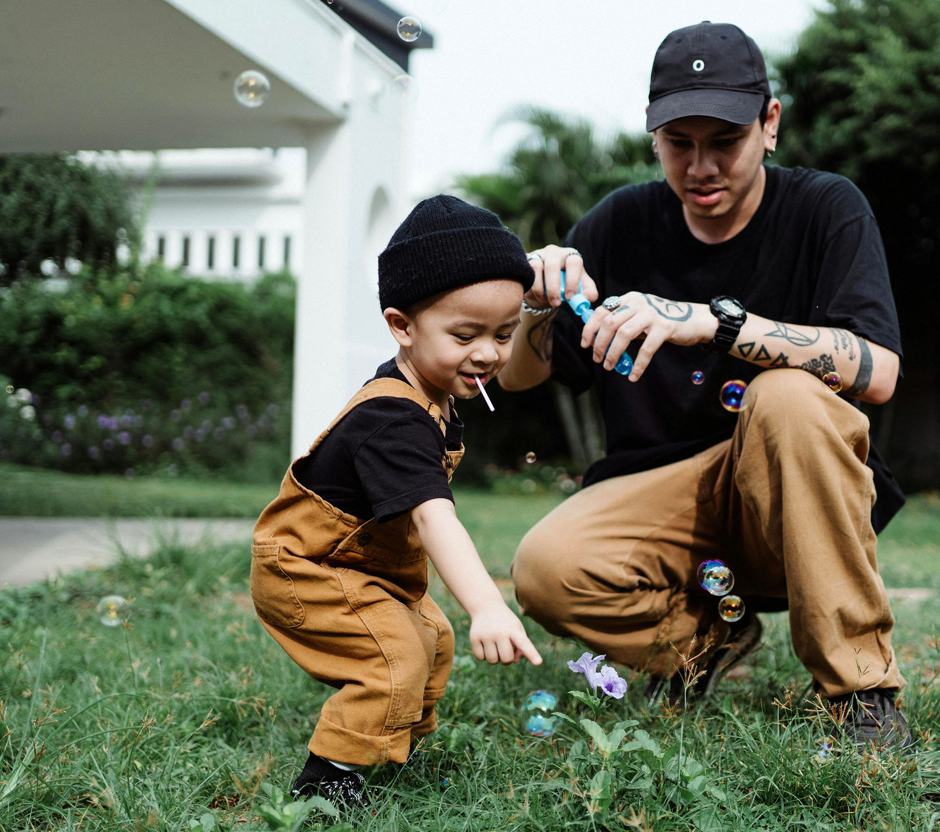 Father and son playing bubbles - Banner